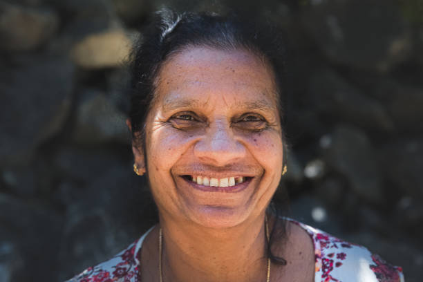 Smiling Sri Lankan Woman Close-up street portrait of a cheerful, smiling, local Sri Lankan woman in the village of Ella, Sri Lanka. sri lankan culture stock pictures, royalty-free photos & images