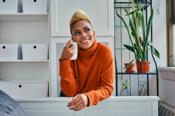 istock Happy Female Hipster Having Coffee At Home 1306698850
