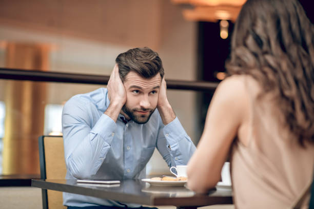istock Man and woman having a blind date and looking disappointed 1306700021