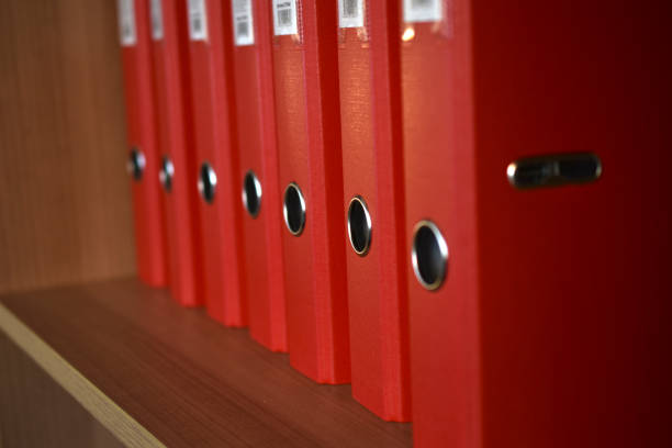 istock Office red folders on the shelf in the office 1306704357