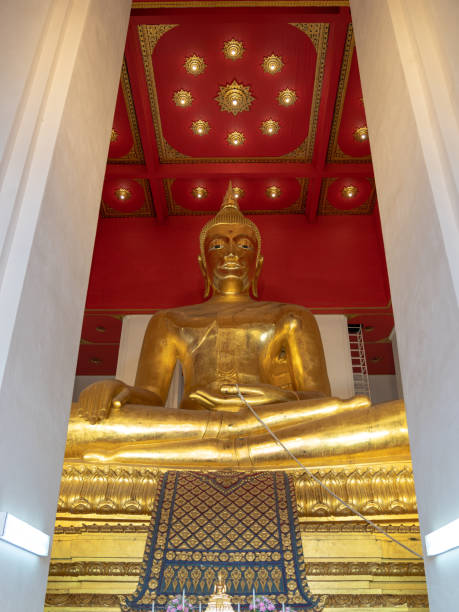 istock big golden buddha statue meditation inside Wihan Phra Mongkhon Bophit chapel 1306712377