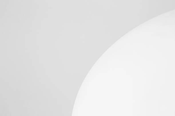 istock Close up minimalist view of a white duck egg against a grey background 1306712473