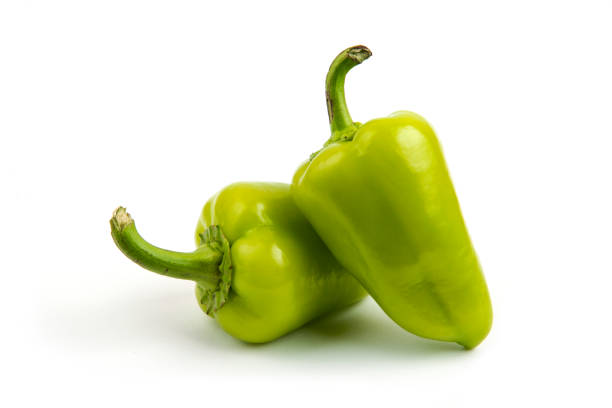 istock Green peppers isolated on white background macro view 1306713170