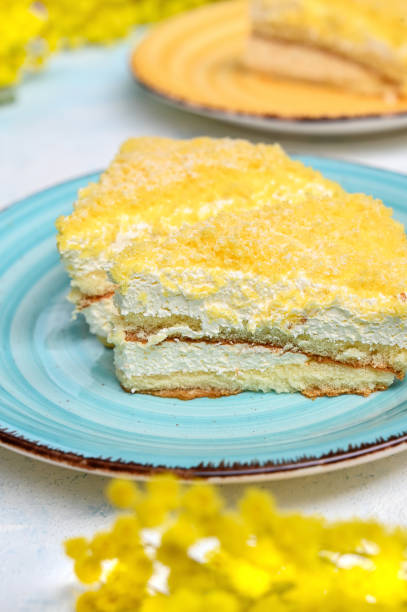 istock Mimosa cake on the plate. Spring breakfast with flowers 1306713800