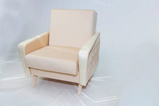 istock Vintage furniture: reclining chair made of fabric, on a light background. 1306714949
