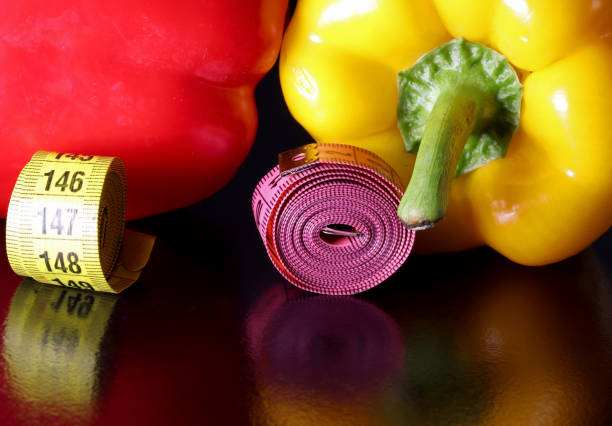 yellow and red pepper and measuring tape