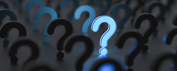 istock Blue glowing question mark on right side with other questions, on dark background, FAQ Concept 1306716020