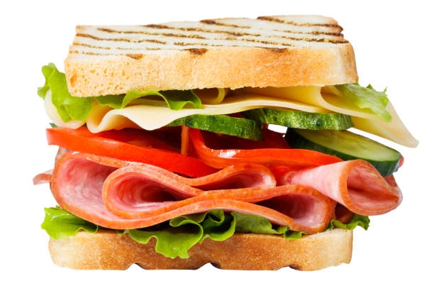 istock Sandwich with ham, cheese, tomato, lettuce and toasted bread isolated on a white background 1306717124