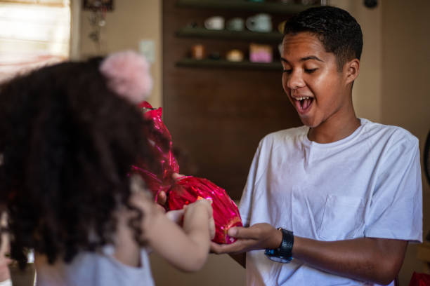 istock Children exchanging and receiving chocolate Easter eggs 1306718463