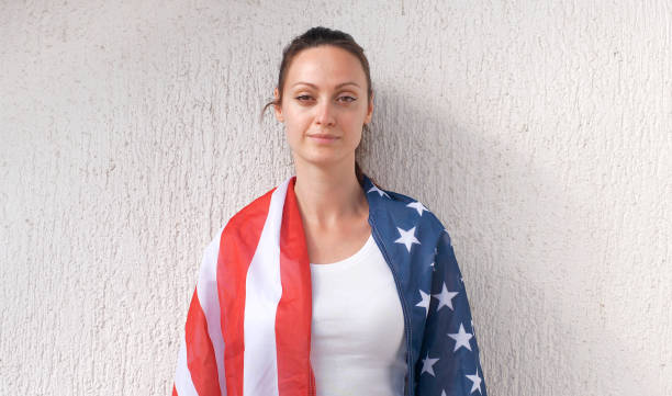 istock Cheering woman under American flag 1306720620