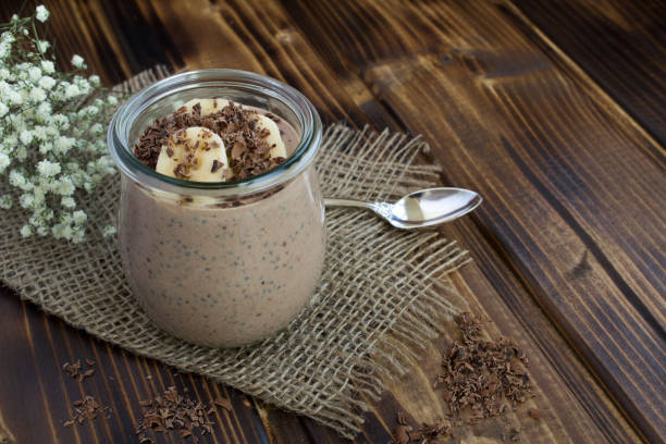 istock Chocolate pudding with chia and banana on the ructic  wooden background 1306720821