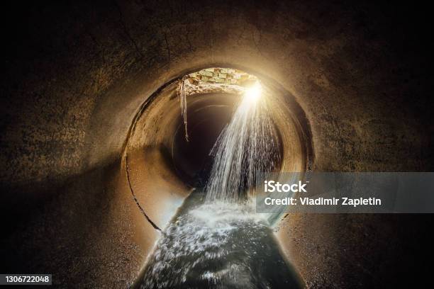 Flooded Vaulted Sewer Tunnel With Water Reflection Stock Photo - Download Image Now - Sewage, Sewer, Pipe - Tube