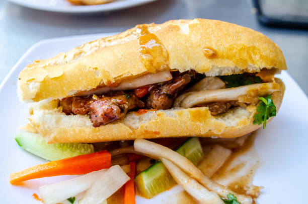 Baguette and grilled meatballs in Cambodia gravy style with sauce Called : Nom pang Num pang