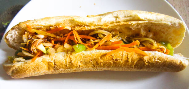 Baguette and sardine sauce  in Cambodia gravy style with Khmer pickles make from white radish and carrots, This food called : Nom pang