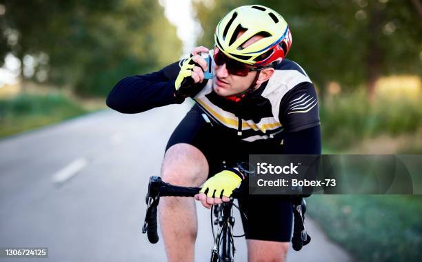 Sports And Asthma Cyclist Using Asthma Inhaler While Riding A Bicycle Sport And Recreation Concept Stock Photo - Download Image Now