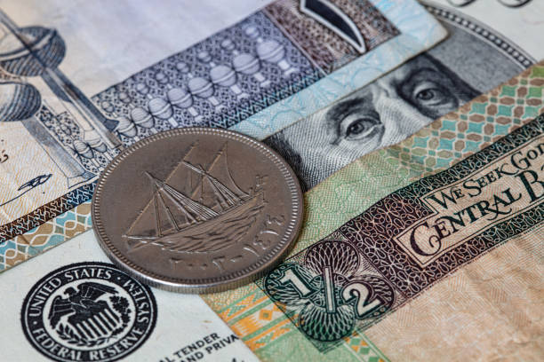 istock dollar and Kuwaiti Dinar 1306725145