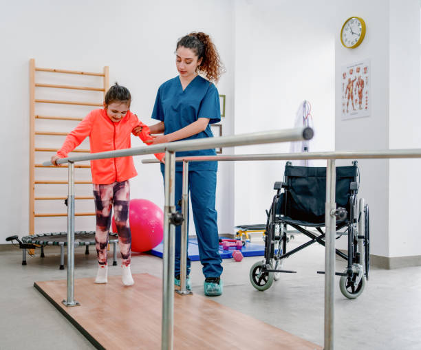 istock Young patient doing physiotherapy at a clinic with help of a therapist 1306728159