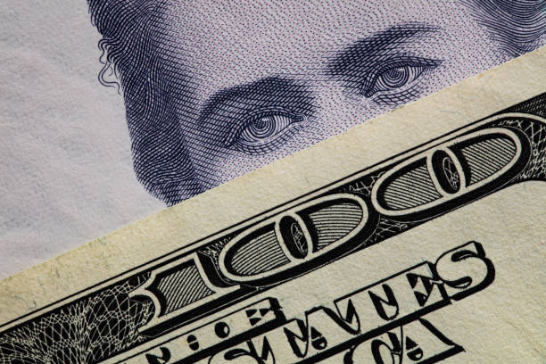 100 dollar banknote on 200 hryvnyas banknote for design purpose