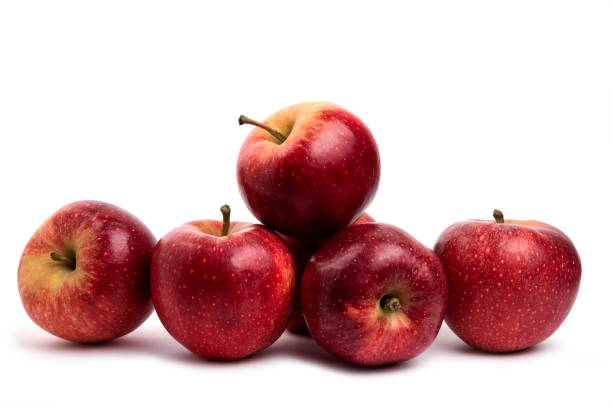 istock Tasty red apples isolated on white background 1306736398