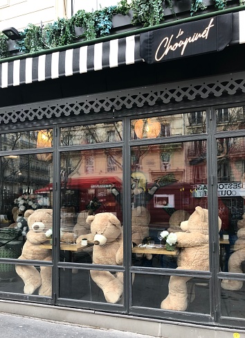 Paris  : Teddy bears at the table, in a café. During Covid-19 pandemic, drink establishments and restaurants are closed. Teddy bears substitute to customers, in cafés, in Quartier Latin, near Panthéon. Paris in France. March 12, 2021
