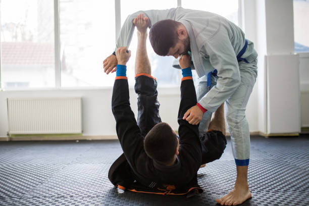 istock Brazilain Jiu JItsu Fighters in training sparing 1306740103