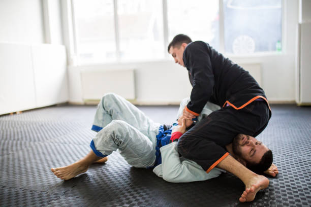 istock Brazilain Jiu JItsu Fighters in training sparing 1306740172