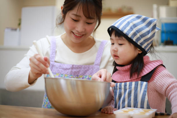 istock Parents and children making sweets 1306742147