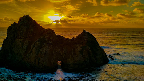 istock Sunset at Keyhole rock in Pfeiffer Beach in California 1306748041