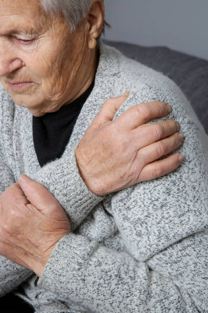 istock Senior woman with shoulder pain 1306751204