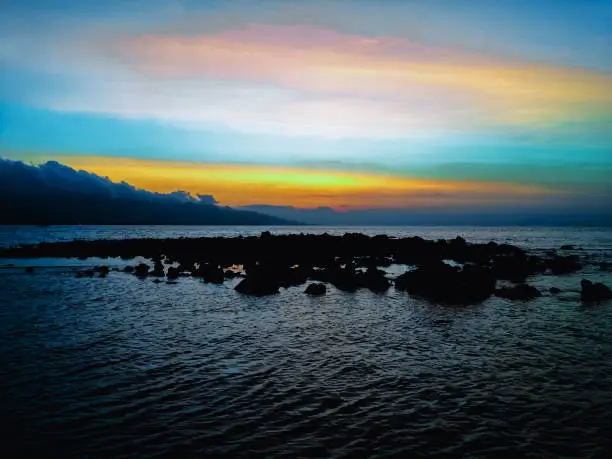 Stunning Sunset Beach Scenery Of Tropical Rocky Fishing Beach At Umeanyar Village, North Bali, Indonesia