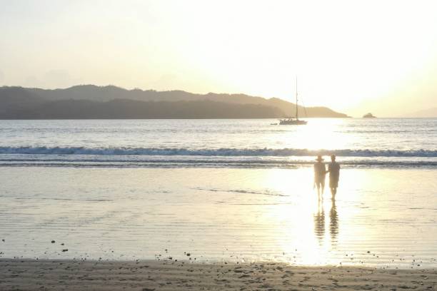 They look off towards Pacific Ocean in the distance