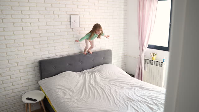 Girl playing in bedroom