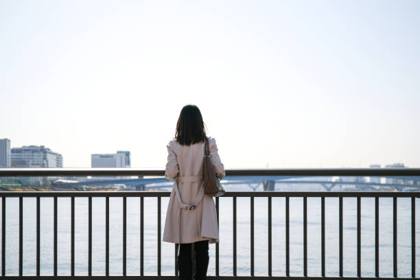 istock Rear view of woman looking at view 1306775603