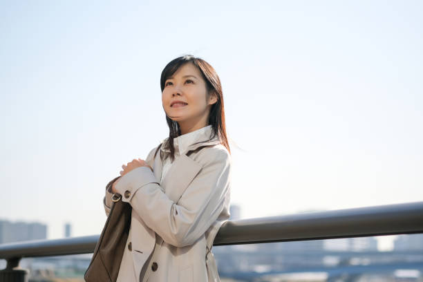 istock Businesswoman looking up at sky 1306775678