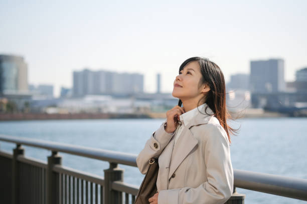 istock Businesswoman looking up at sky 1306776220