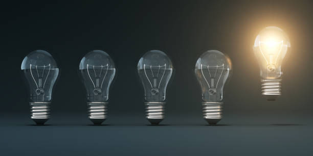 istock Light Bulb on Black Gradient Background Stock Photo 1306776449