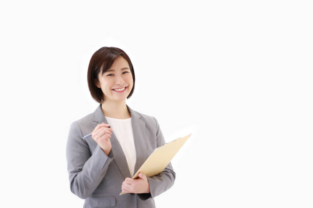 istock Female employee with binder 1306779026