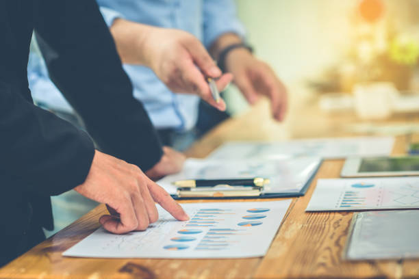 istock Business Corporate team brainstorming with chart and checking and analysis 1306780715