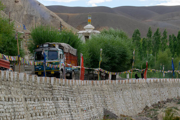 Mulbekh, Ladakh, India - 2nd September 2014 : Truck carrying consignment at Ladakh road. Himalayan mountain in the background.