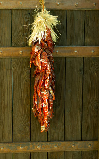 istock New Mexico: Chili Pepper Ristra on Brown Gate 1306782458