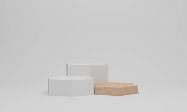 istock 3d render. White podium in hexagon shape. Pedestal mockup on white background. 1306787406