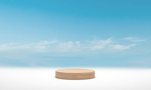 istock Minimal podium wood cylinder podium over blue sky cloud background. 3d render 1306788225