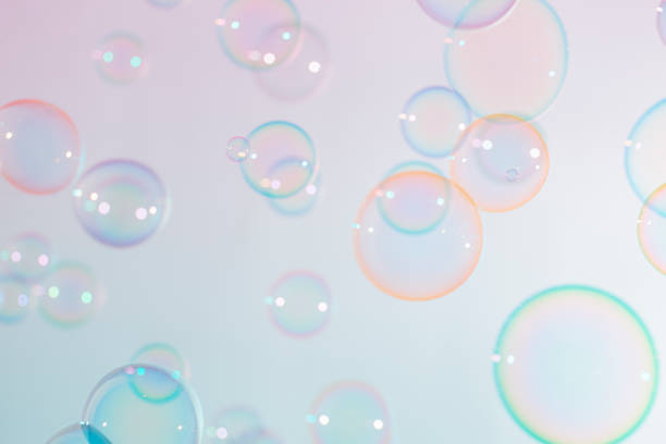 istock Beautiful transparent colorful soap bubbles floating background. 1306788994
