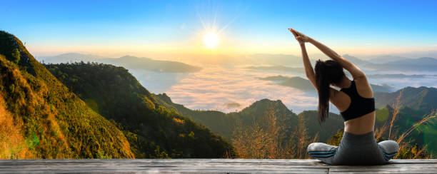 istock Young woman practicing yoga in the nature 1306789760