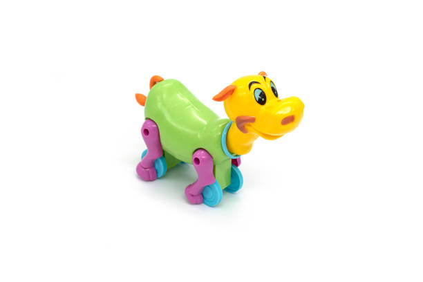 istock Isolated plastic cow toy photo on white background. 1306791639
