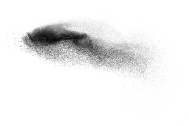 istock Black particles splatter on white background. Black dust splash on white background. 1306800382