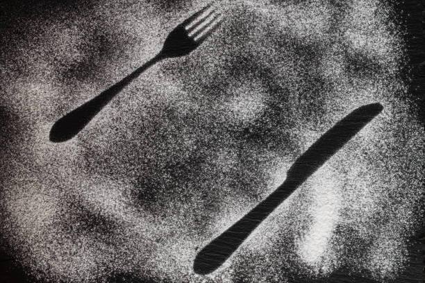 istock fork and knife silhouette made with flour 1306802303