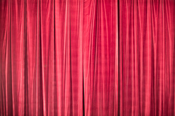 istock Red curtain in theatre. 1306803242