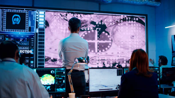 istock Team supporting spacecraft docking with orbital station 1306803503