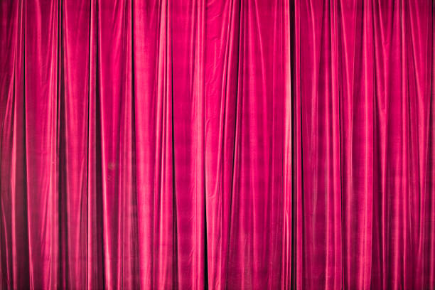 istock Red curtain in theatre. 1306803537